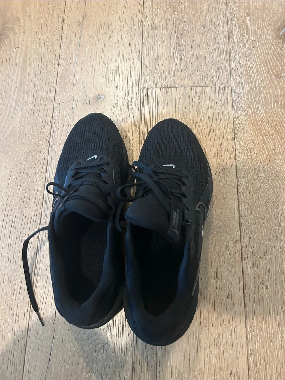 Nike Black Low-Top Sneakers with White Swoosh Accent